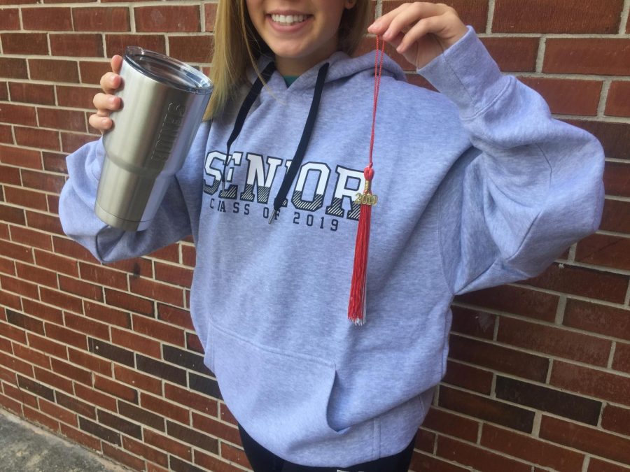 Finally feeling like seniors, students queued up in the lunchroom to place their cap and gown orders and pick up staple senior swag items. Some students opted to purchase bundled packages, which included different 2019 attire and memorabilia. 
