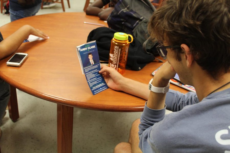 This intrigued NC student examines Andy Clark’s campaign brochure while he listens to Clark talk about his plans on changing the community as Senator. Clark hopes to convince the young community to spread the word and vote for him in the upcoming election.