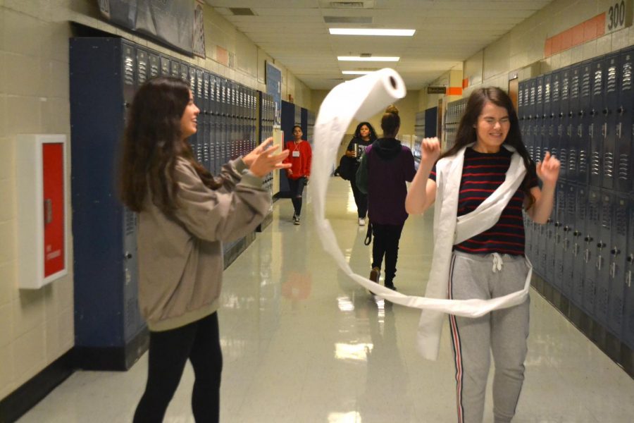 Juniors Molly McGouirk and Katie Word enjoy playing tricks on others as the spooky season approaches. Instead of traditional toilet papering houses, Word added a weird twist and began toilet papering fellow classmate McGouirk. “Tricks are my favorite part of Halloween, but sometimes they go a little too far,” McGouirk said. 