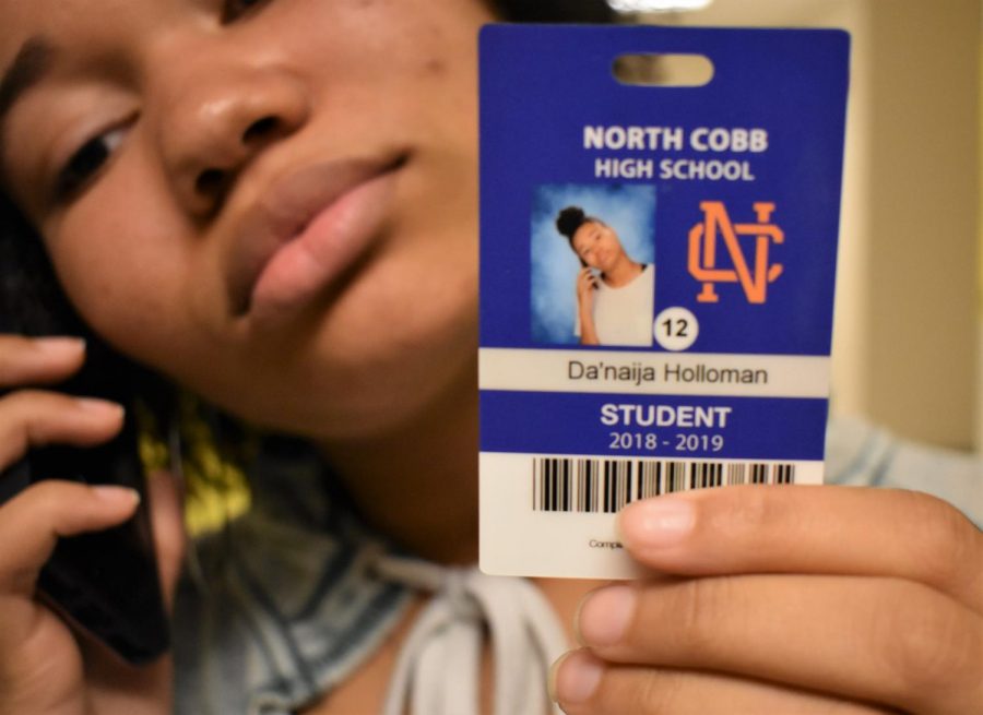 Senior Da’Naija Holloman held up her phone and puckered out her lips, making a “sassy face” for her senior ID shot. “My mom inspired me to come up with the ‘mood’ look when she asked what I looked like at school. At school, I have my phone in my hand and I look mean, so I recreated that for my ID. I want people to remember my normal everyday look around school,” Holloman said. 
