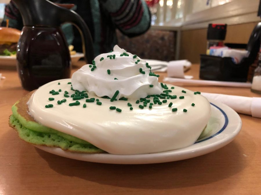 Grinchy green pancakes flooded with sweetened cream cheese sauce and topped with a swirl of whipped cream bring an ache to many a sweettooth among us, but get them while theyre hot because theyre gone at the end of the year.