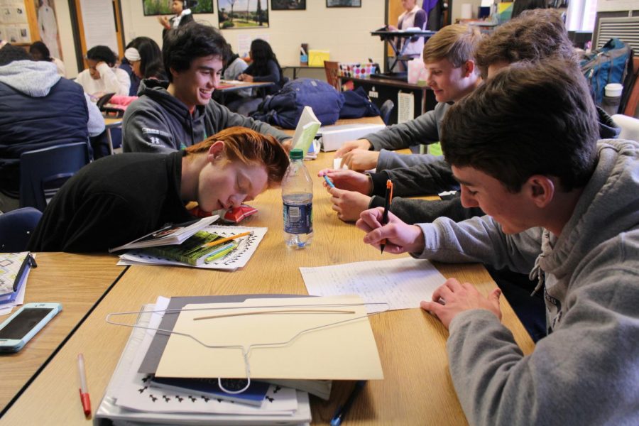 Confusion and excitement sent Mrs. Lawson’s Honors American Lit class abuzz as she gave students a project to complete—except with a twist—no clear instructions, an abstract objective, and complete silence when students asked her confused questions. Students received a manila folder of supplies to construct the purpose of the project. “We picked up a manila folder with a coat hanger, string, a stick, an index card, black construction paper, and a notecard. All we know is that we have to relate the project back to the unit: Individuals Taking a Stand,” junior Aiden Minard said. Though abstract in concept, the project pushed students past their creative boundaries. “This project delves into our creativity by making us think more creatively and to better understand the theme of this unit,” junior Patrick Moran said. 