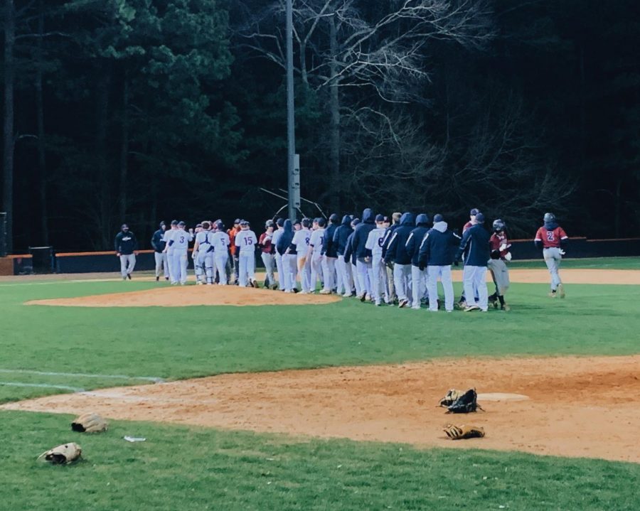 NC Varsity Warriors celebrated a win against the Woodstock Wolverines on Tuesday, March 5. “Woodstock isn’t what they were last year and we showed them that. I felt good during the game, the team had my back and we produced when we needed it,” senior pitcher Jonathan Young said. 