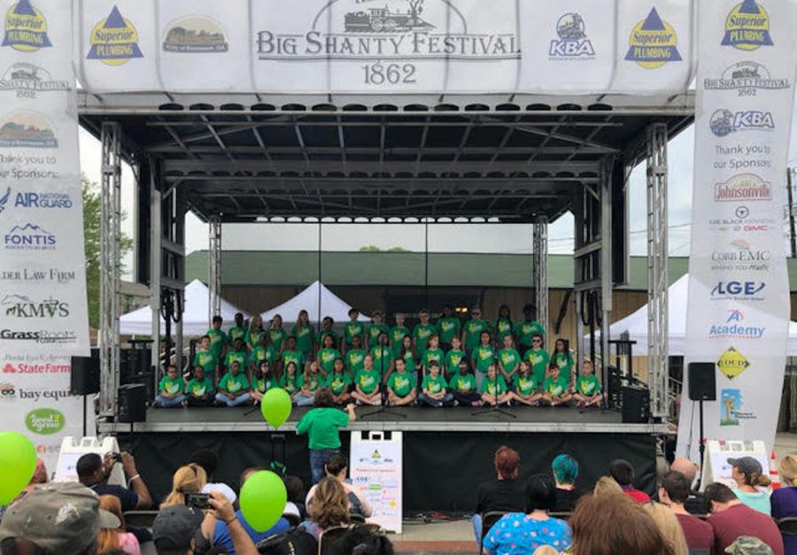 For over eleven years, the Baker Elementary School chorus sings their way into the hearts of patrons at the Big Shanty Festival. This year, director Fonda Riley directed students on stage as they sang five songs. “At first, I was a bit scared, well, nervous, and I was honestly excited too because I had a solo. I couldn’t wait to perform in front of all those people,” Baker Elementary fourth-grader Zoë Zavala said. 