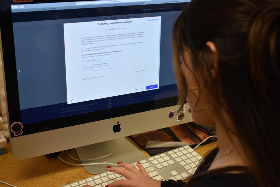 Senior Natalia Duron uses Khan Academy to complete homework for her AP Statistics course. Khan Academy provides an online service to streamline education at home, providing supplemental resources and an extra way for students to understand the content of high school classes.