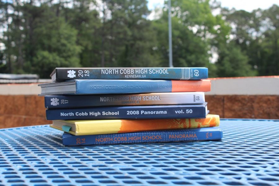 NC’s yearbook staff put in their best efforts to display their yearly project of the school yearbook. As students count down the days until graduation, they purchase yearbooks to commemorate the 2018-2019 school year and reminisce over student accomplishments throughout the different grade levels, athletics, and school events. Interested inpurchasing a yearbook? See Mrs.Husband in the freshman academy and purchase a yearbook in the upcoming weeks.   