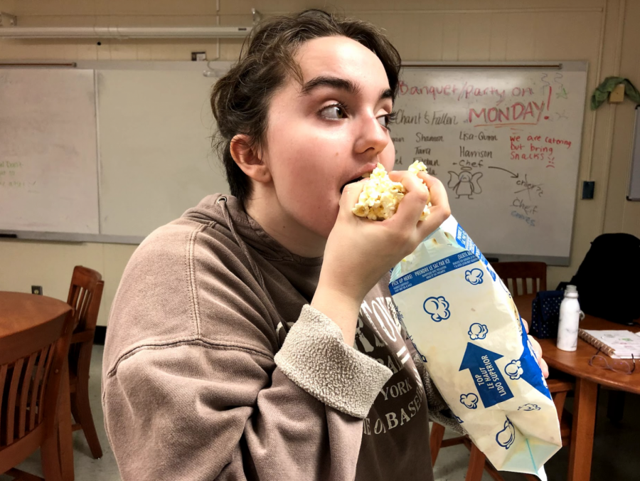 This movie-goer excitedly shoves popcorn in her mouth in anticipation for the upcoming movies that will release in theaters. Kennesaw/Acworth locals can find any of the upcoming films they wish to see at NCG, AMC at Barrett Commons, or Regal Cinemas at Town Center.