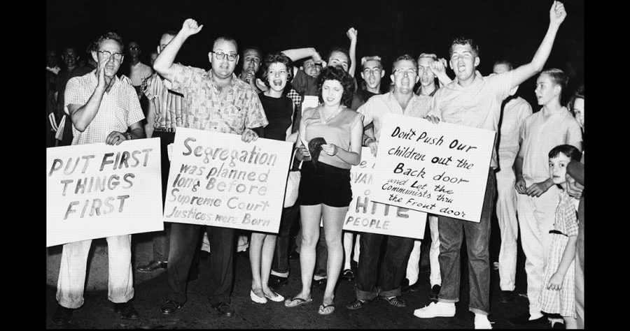 125 White, Georgia Students rallied in front of the Governor’s Mansion, protesting against school integration, on July 13, 1959. Inside the mansion, Gov. Ernest Vandiver, 20 attorneys, and lawmakers drafted plans for continuing a legal battle against the integration of Georgia schools. 