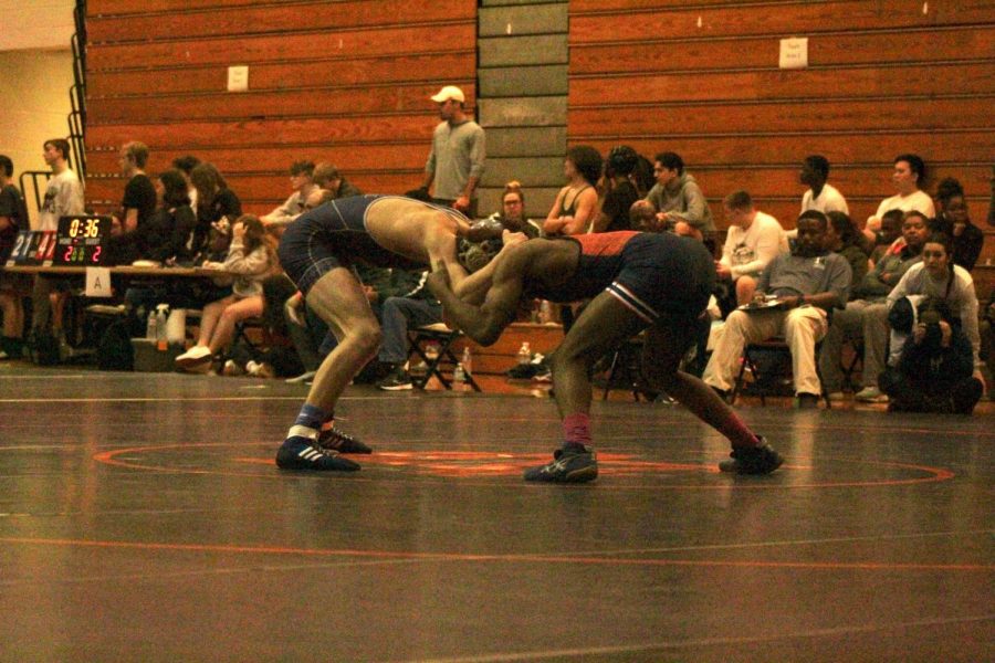 NC+Varsity+wrestlers+began+their+annual+regions+tournament+held+at+NC.+Senior+Jemal+Kinchen+wrestles+off+against+Marietta+hoping+to+come+through+with+a+win+to+put+NC+in+the+next+round.+Although+the+Warriors+did+not+win+the+tournament%2C+the+athletes+and+coaches+left+with+their+heads+held+high+for+next+weekend%E2%80%99s+tournament.+