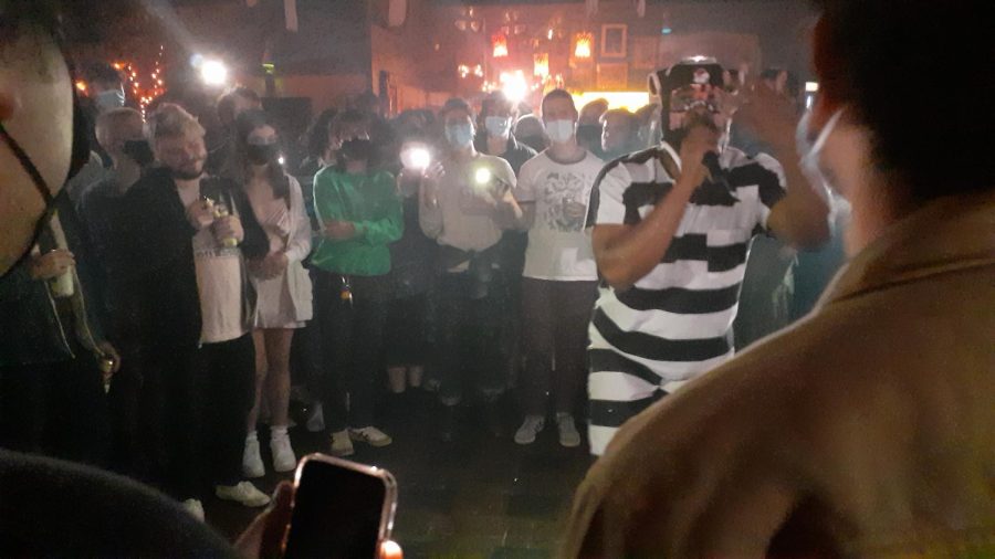Concertgoers stand in a circle around the high-energy performer, Exum, as he raps about his experience with heart failure and not living life to the fullest. While his act did not lack talent, his particular brand did not entirely land with the audience.
