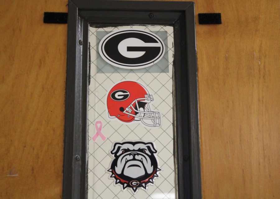 Inside American literature teacher Alex Yeganegi’s room, several Georgia Bulldog stickers adhere to her door, showing her Georgia pride. Yeganegi graduated in the class of 2008, receiving her Bachelors degree. She loves rooting for the Bulldogs and has supported them for 17 years.