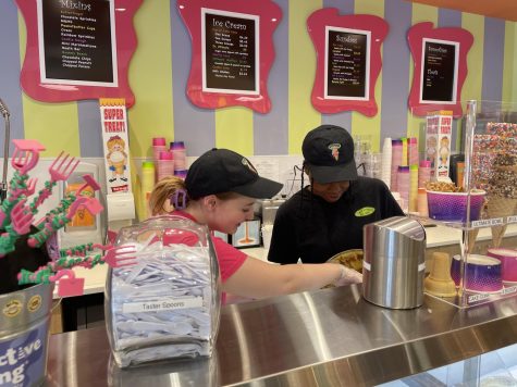 NC junior Imani Wilson and sophomore Aubrey McPherson work as Scoops employees on the weekends. Students and their families in Downtown Acworth frequently visit Scoops for their delicious array of ice cream flavors available. “It is really fun [working with people from school] because we get to relate on different topics all the time. When we’re at school we can also talk about work, and it is easy because if we see each other at school and we need to change shifts, instead of texting each other it’s a lot easier [to talk to each other at school],” McPherson says. 
