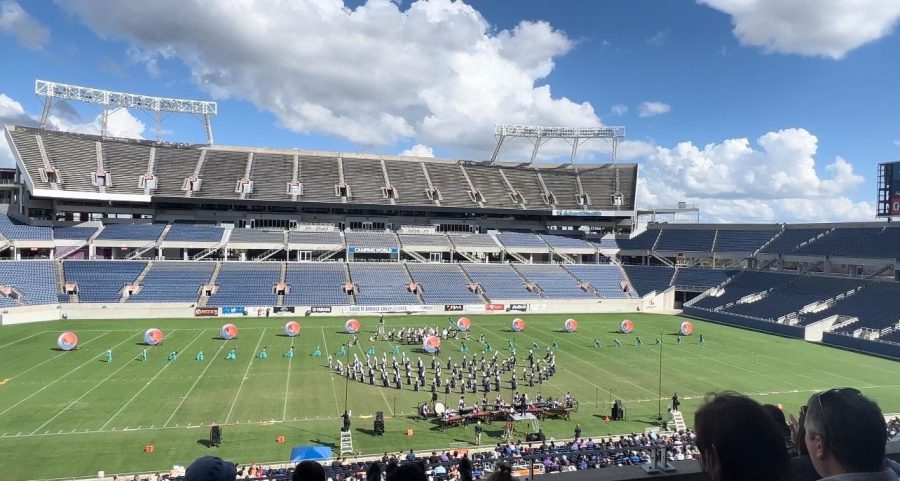 The+NC+marching+band+participated+in+the+Bands+of+America+Orlando+Regional+competition+Saturday%2C+October+22.+The+band+performed+their+show%2C+%E2%80%9CKokopelli+Dances%2C%E2%80%9D+for+an+eager+audience+of+judges%2C+family+members+and+other+bands+from+around+the+region.+In+the+photo%2C+the+band+steps+into+their+pre-show+set%2C+which+features+a+solo+by+magnet+senior+Jasmine+Negron.