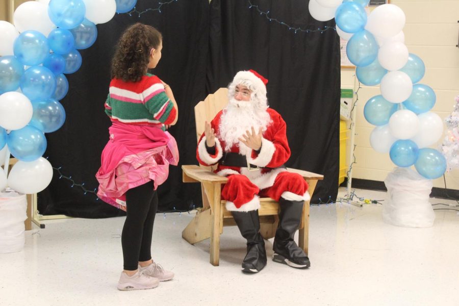 Originally planned for December 6,  American Sign Language (ASL) teacher Lisa Teschke hosts an event for deaf children from Shallowford Falls Elementary to meet Santa Claus. ASL students and club members decorated the freshman cafeteria with balloons, tables, snowflakes and Christmas lights to set the festive tone. 