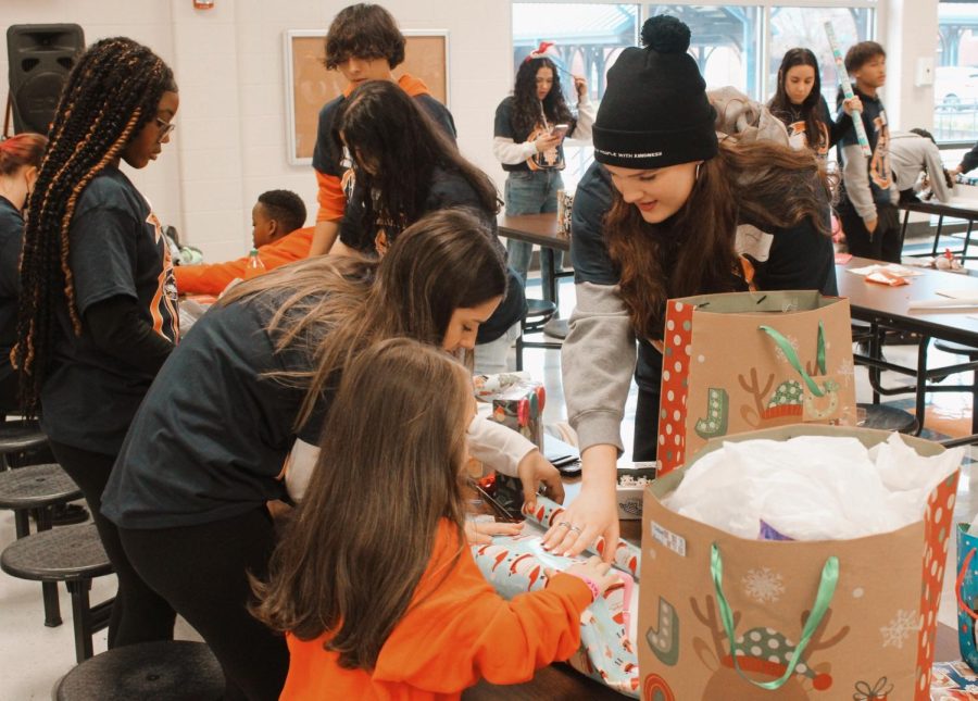 The+18th+annual+Shop+With+a+Warrior+allows+high+school+students+to+bring+holiday+cheer+to+children.+The+long-running+tradition+teaches+NC+students+the+importance+of+gifting+to+underprivileged+children+with+a+memorable+Christmas.+NC+staff+members+and+students+worked+diligently+to+make+the+event+exceptionally+successful+and+the+kids+happy.%0A