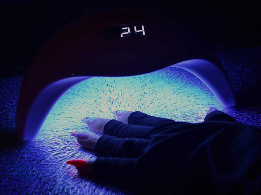 The aesthetic of receiving a mani-pedi to relieve stress now shifts to a hazardous activity exposing skin cuticles to potentially fatal UV radiation that alters DNA. The device, also referred to as curing lamps or UV dryers, frequently uses lamps or LED lights to dry the gel nail polish applied. The ultraviolet radiation produced by the devices LEDs causes cell death and alterations to human cells. To prevent further exposure, a surge of protective UV gloves promotes consideration of the lamps dangerous effects.