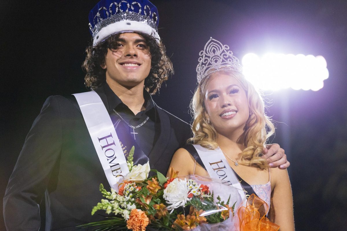 Senior Juan Patarroyo and magnet senior Natalie Salomón pose after winning Homecoming King and Queen for the 2023-24 school year.