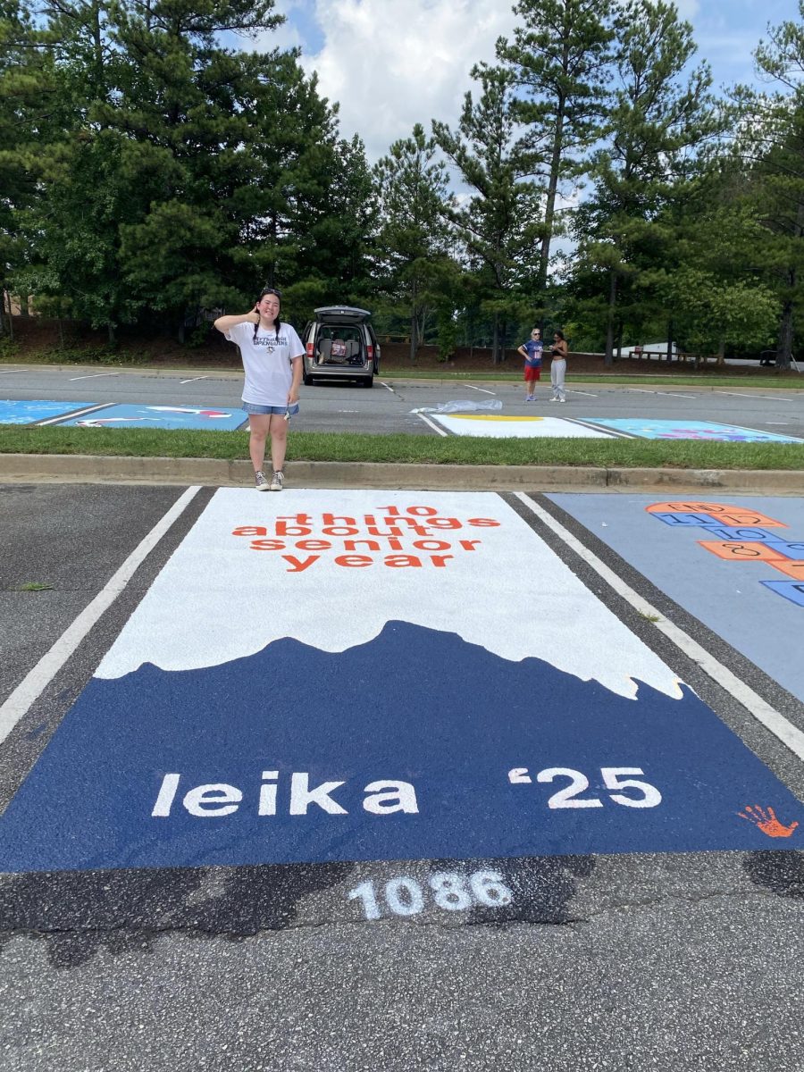 Magnet senior Leika Badstibner holding a thumbs up next to her beloved “10 Things I Hate About You” inspired parking spot.