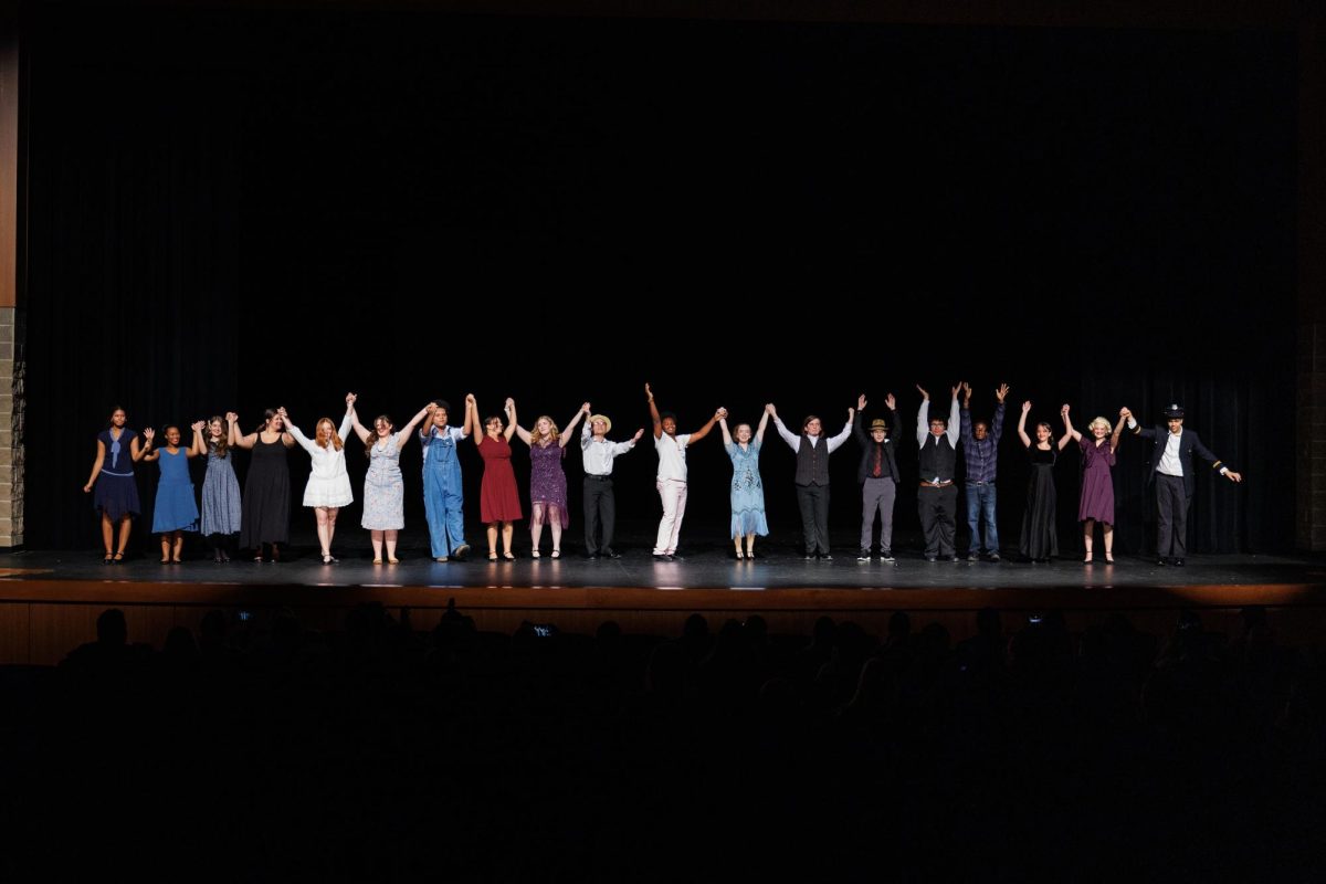 The cast and crew join hands after their run of “The Great Gatsby.”